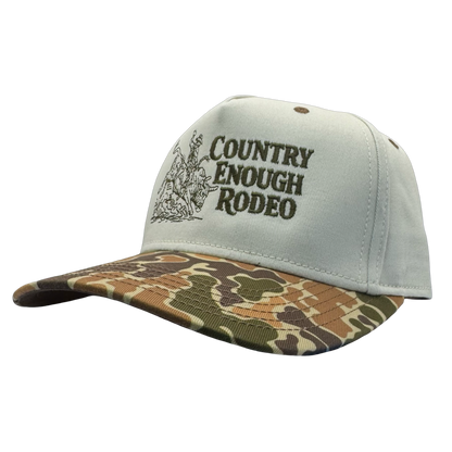 Legacy heritage snapback hat with graphic of bull rider on a bucking bull and the words country enough rodeo #duckcamo