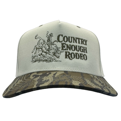 Legacy heritage snapback hat with graphic of bull rider on a bucking bull and the words country enough rodeo #bottomland