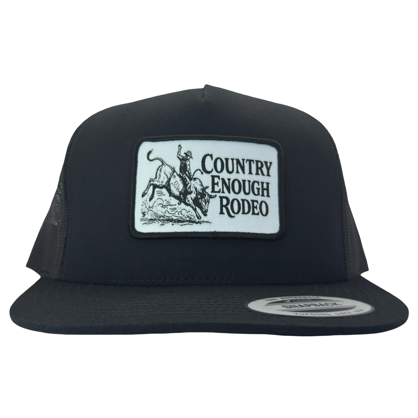 Yupoong 6006 flat bill snapback with a patch that contains graphic of a bullrider and bucking bull and words country enough rodeo #black