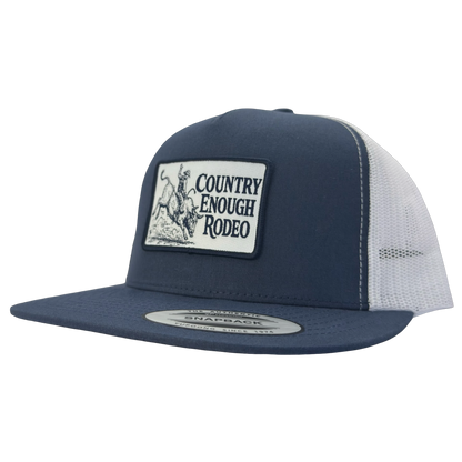 Yupoong 6006 flat bill snapback with a patch that contains graphic of a bullrider and bucking bull and words country enough rodeo #navy/white