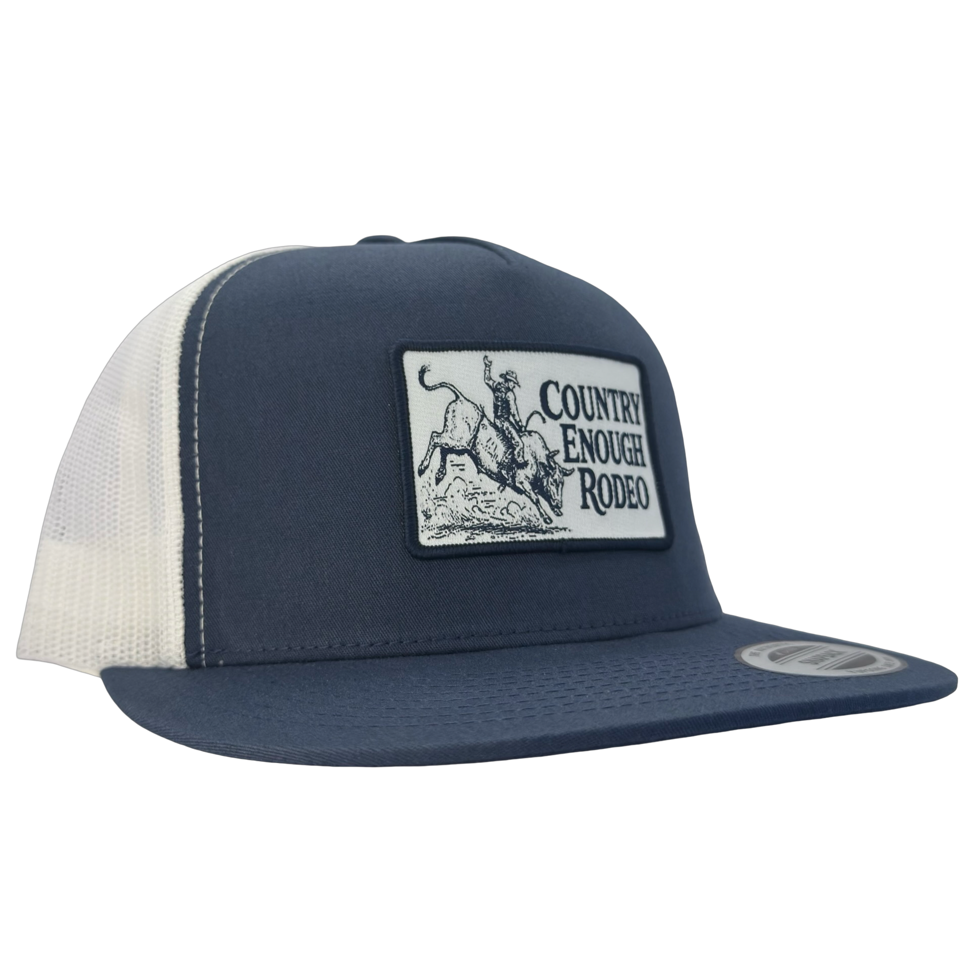 Yupoong 6006 flat bill snapback with a patch that contains graphic of a bullrider and bucking bull and words country enough rodeo #navy/white