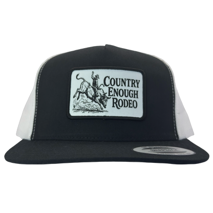 Yupoong 6006 flat bill snapback with a patch that contains graphic of a bullrider and bucking bull and words country enough rodeo #black/white