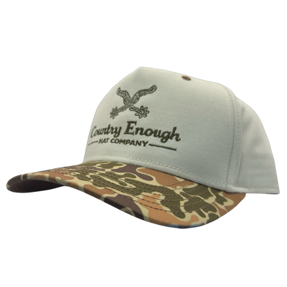 Legacy heritage snapback hat with graphic of spurs and words country enough hat company #duckcamo