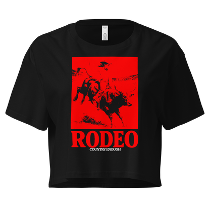 Black crop top with bright red graphic of a cowgirl riding a bull and the word rodeo below #black