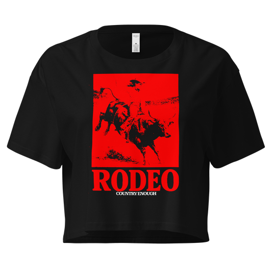 Black crop top with bright red graphic of a cowgirl riding a bull and the word rodeo below #black