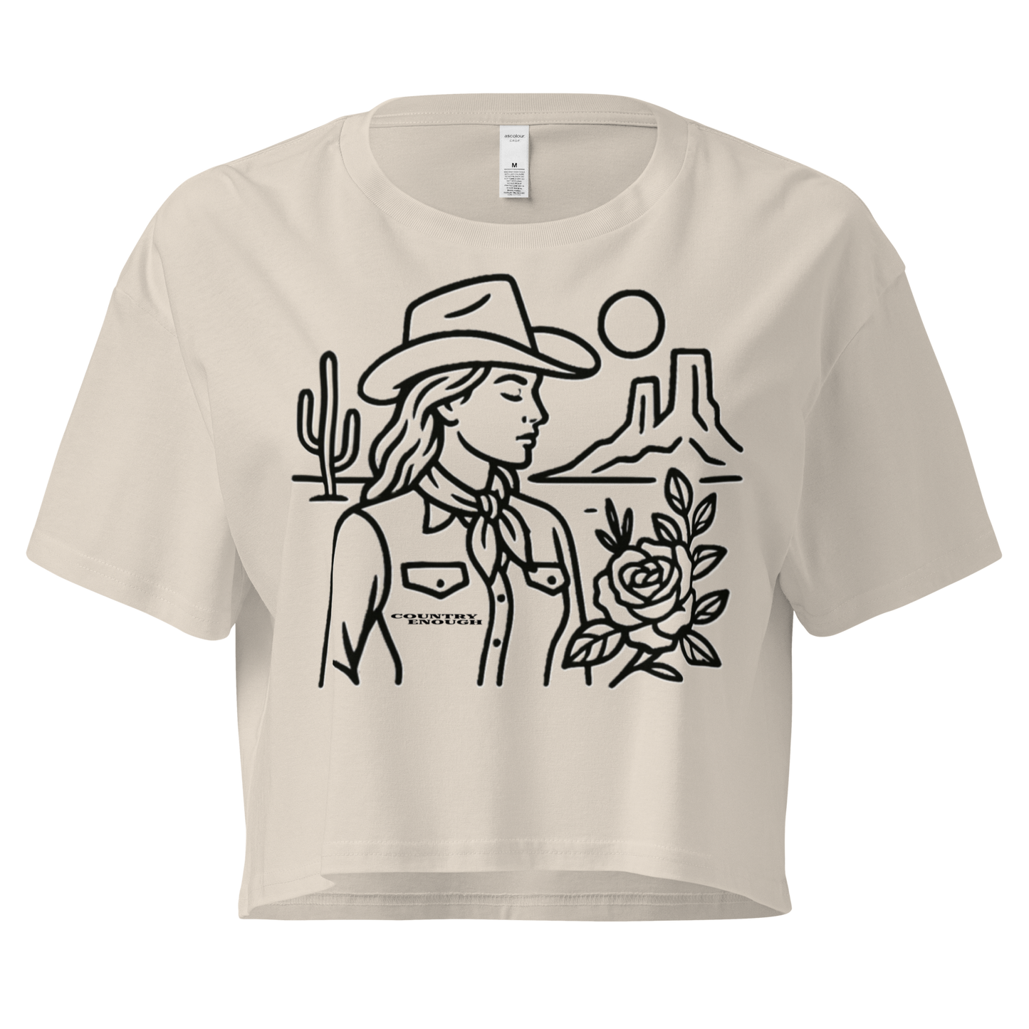 Bone crop top with graphic of a cowgirl, desert landscape, sun, cacti, and rose #bone