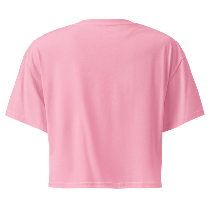 Pink crop top with graphic of bull skull in front of a circular desert landscape with rope border and word cowboy below #pink