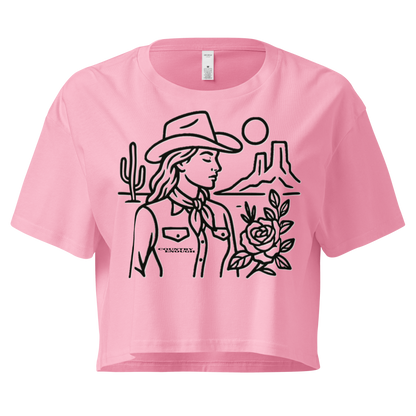 Pink crop top with graphic of a cowgirl, desert landscape, sun, cacti, and rose #pink