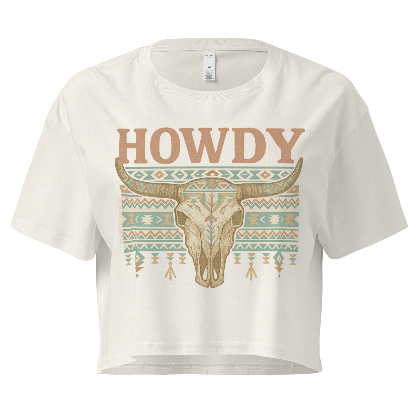 Ecru crop top with graphic of bull skull, aztec pattern, and the word howdy #ecru