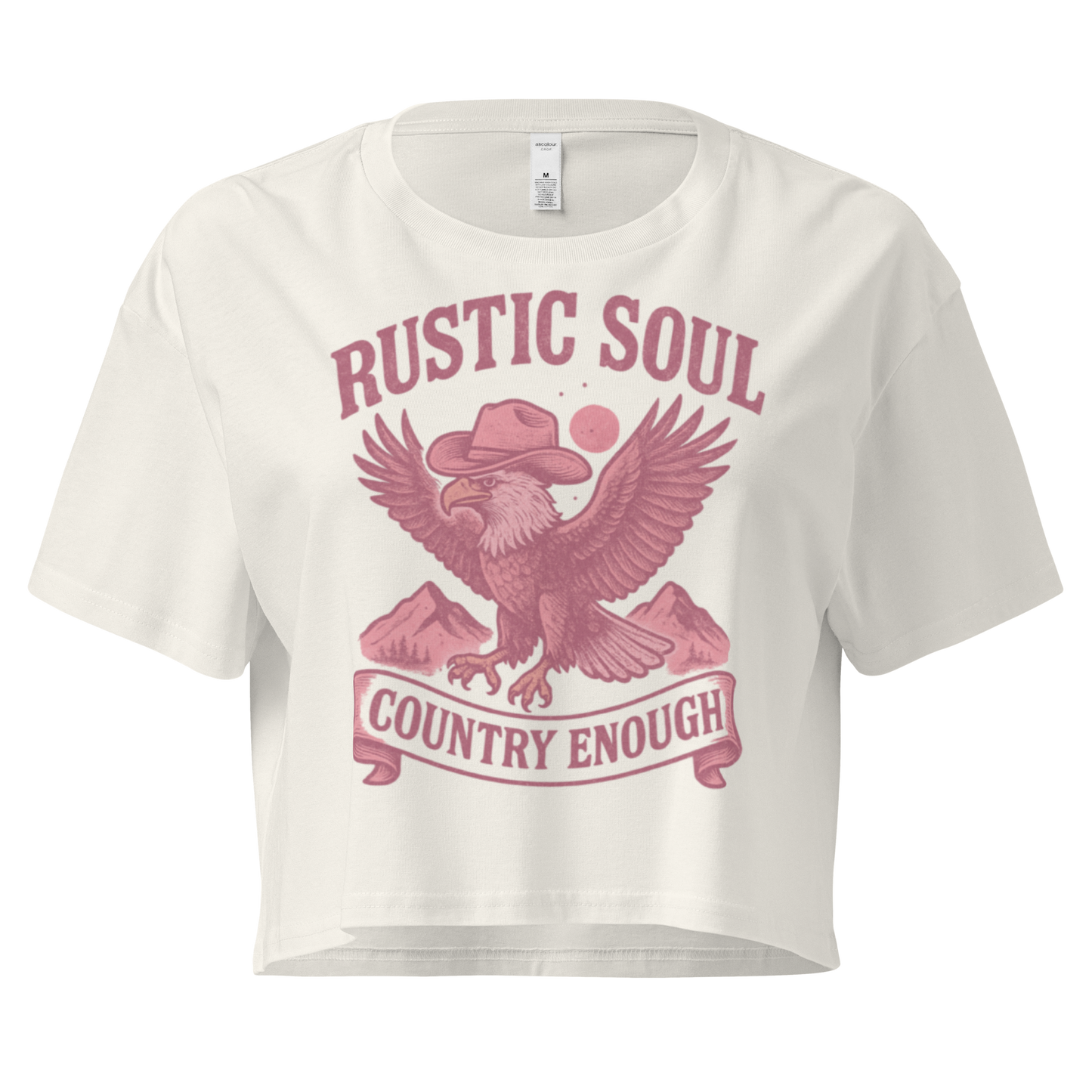 Ecru crop top with graphic of cowboy hat wearing eagle, mountains, and words rustic soul and country enough #ecru