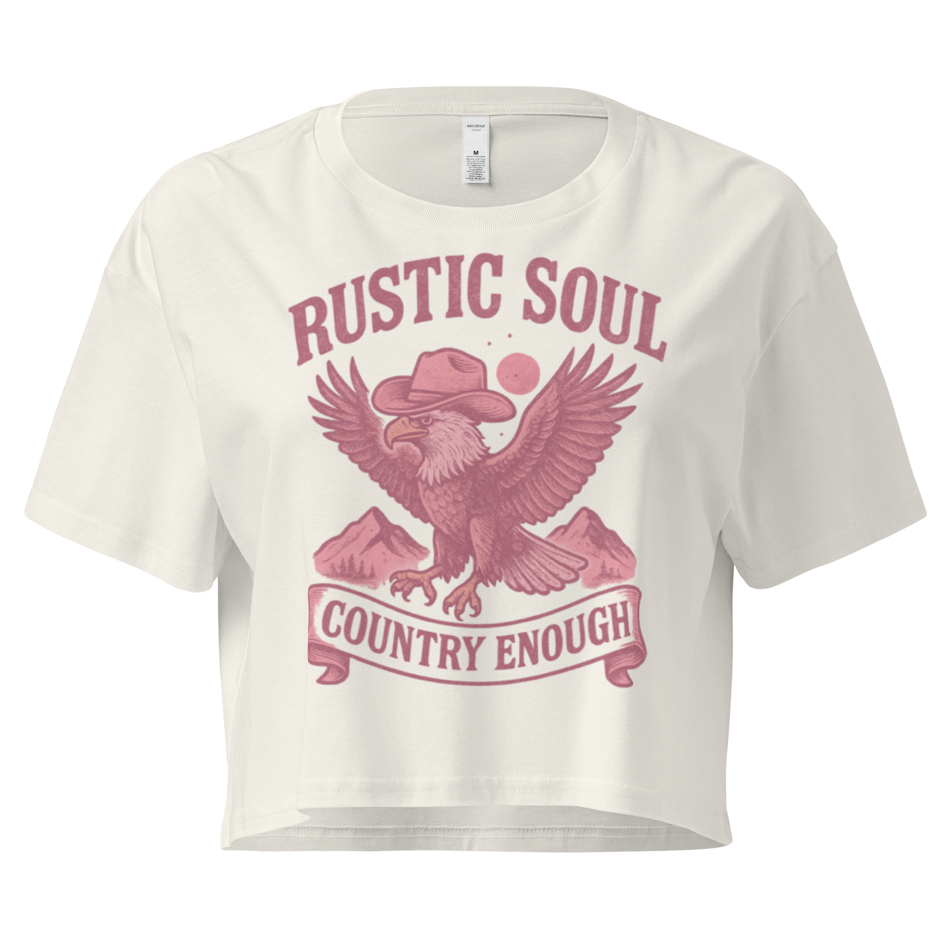 Ecru crop top with graphic of cowboy hat wearing eagle, mountains, and words rustic soul and country enough #ecru