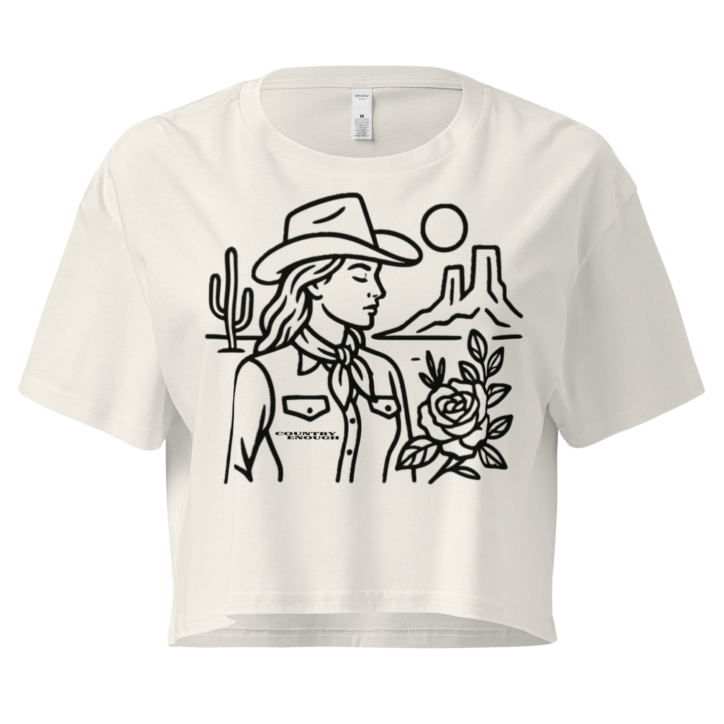 Ecru crop top with graphic of a cowgirl, desert landscape, sun, cacti, and rose #ecru