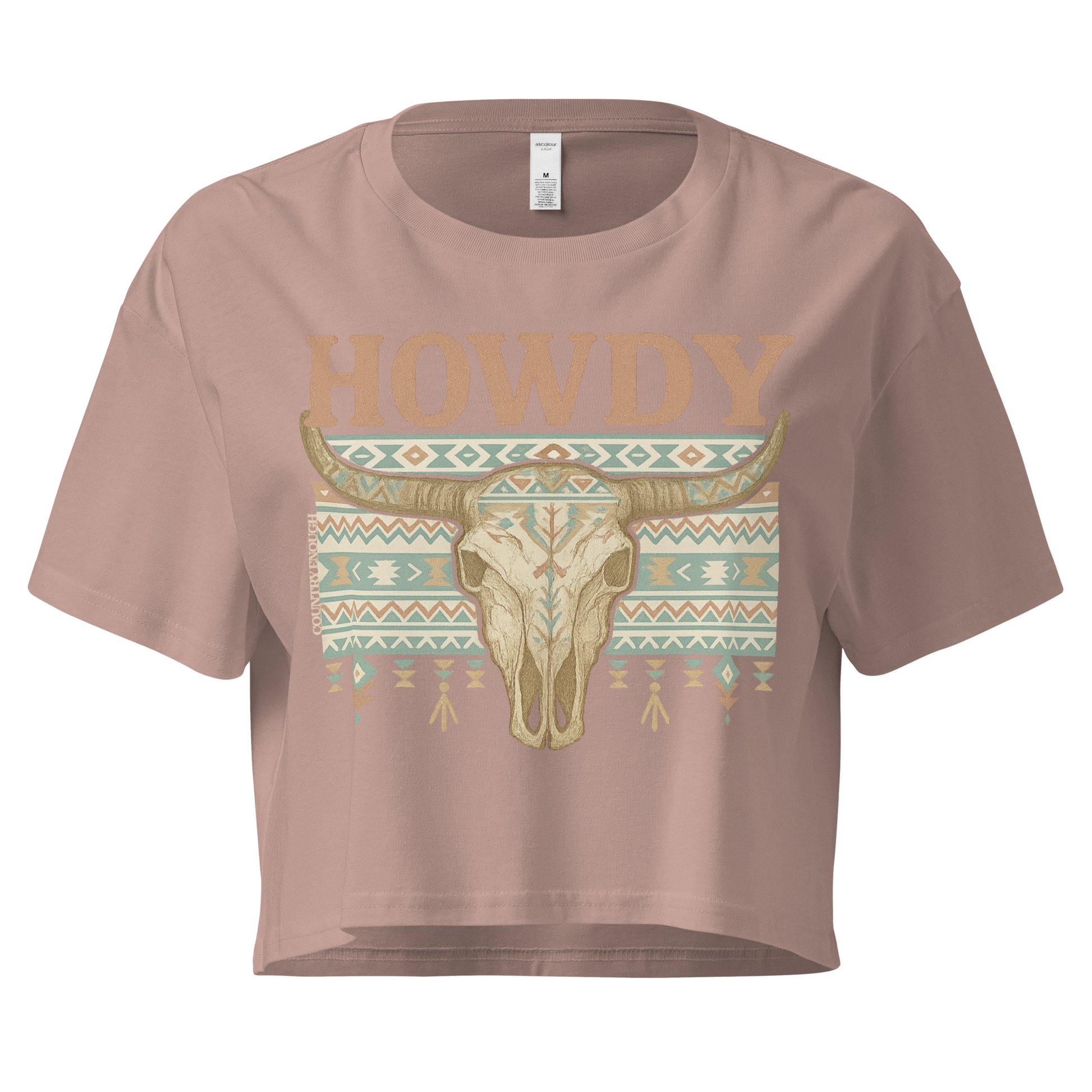 Hazy Pink crop top with graphic of bull skull, aztec pattern, and the word howdy #hazypink