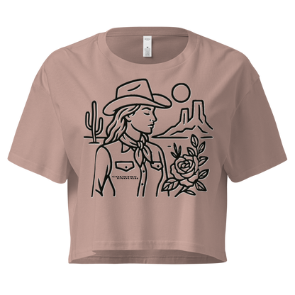 Hazy Pink crop top with graphic of a cowgirl, desert landscape, sun, cacti, and rose #hazypink