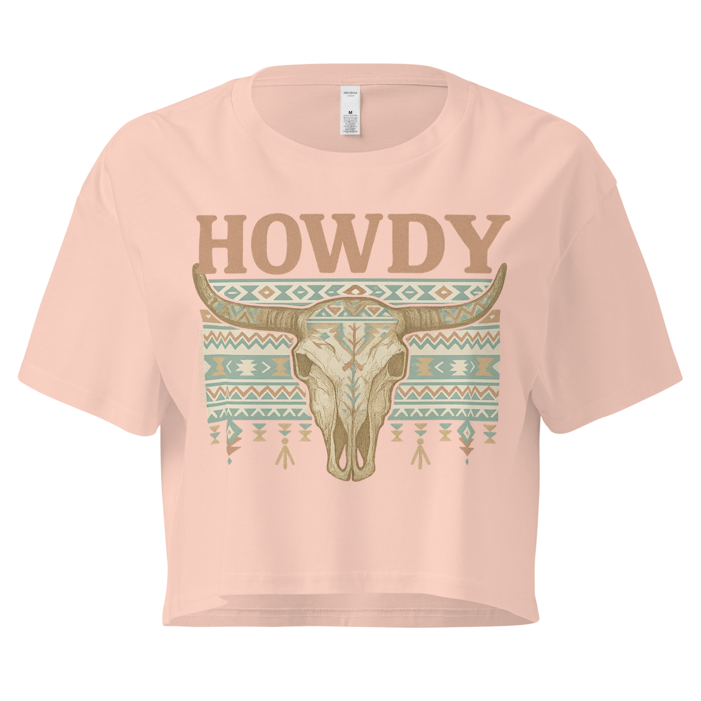Pale Pink crop top with graphic of bull skull, aztec pattern, and the word howdy #palepink