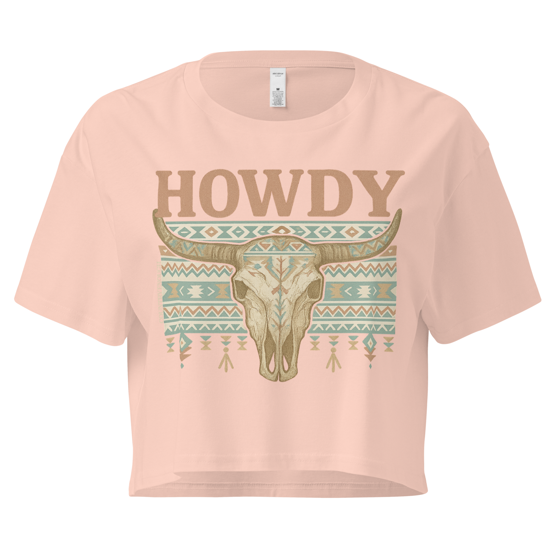Pale Pink crop top with graphic of bull skull, aztec pattern, and the word howdy #palepink