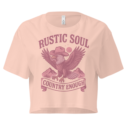Pale Pink crop top with graphic of cowboy hat wearing eagle, mountains, and words rustic soul and country enough #palepink