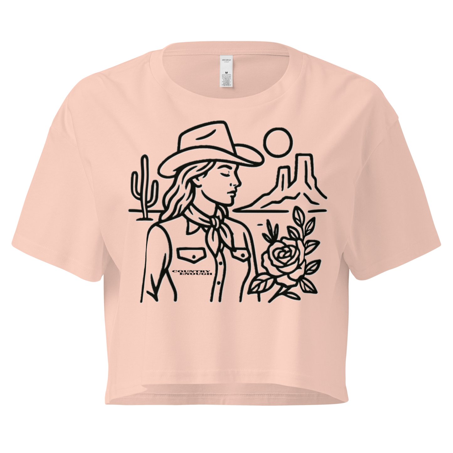 Pale Pink crop top with graphic of a cowgirl, desert landscape, sun, cacti, and rose #palepink