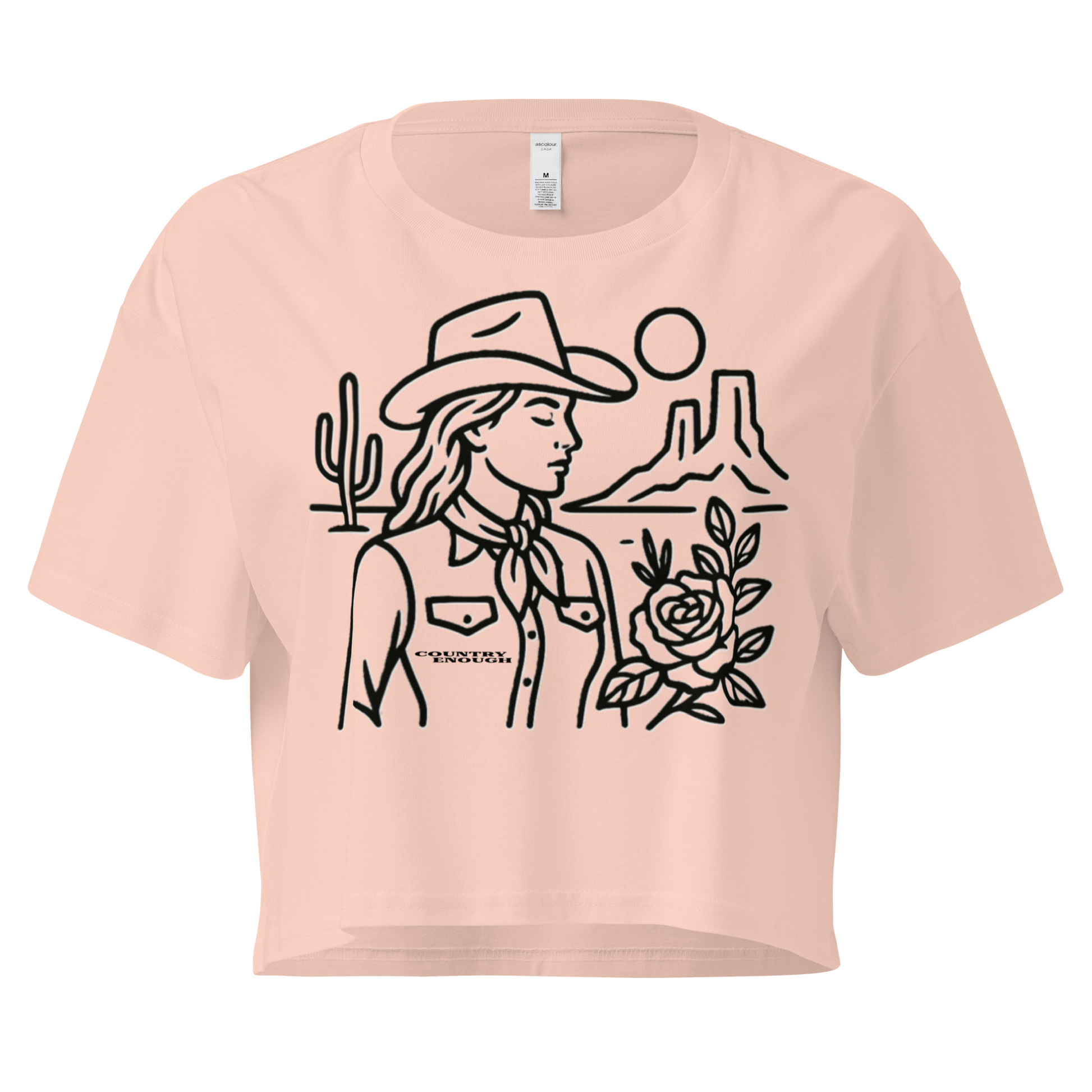 Pale Pink crop top with graphic of a cowgirl, desert landscape, sun, cacti, and rose #palepink