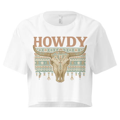 White crop top with graphic of bull skull, aztec pattern, and the word howdy #white