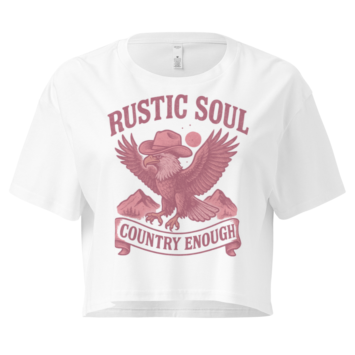 White crop top with graphic of cowboy hat wearing eagle, mountains, and words rustic soul and country enough #white