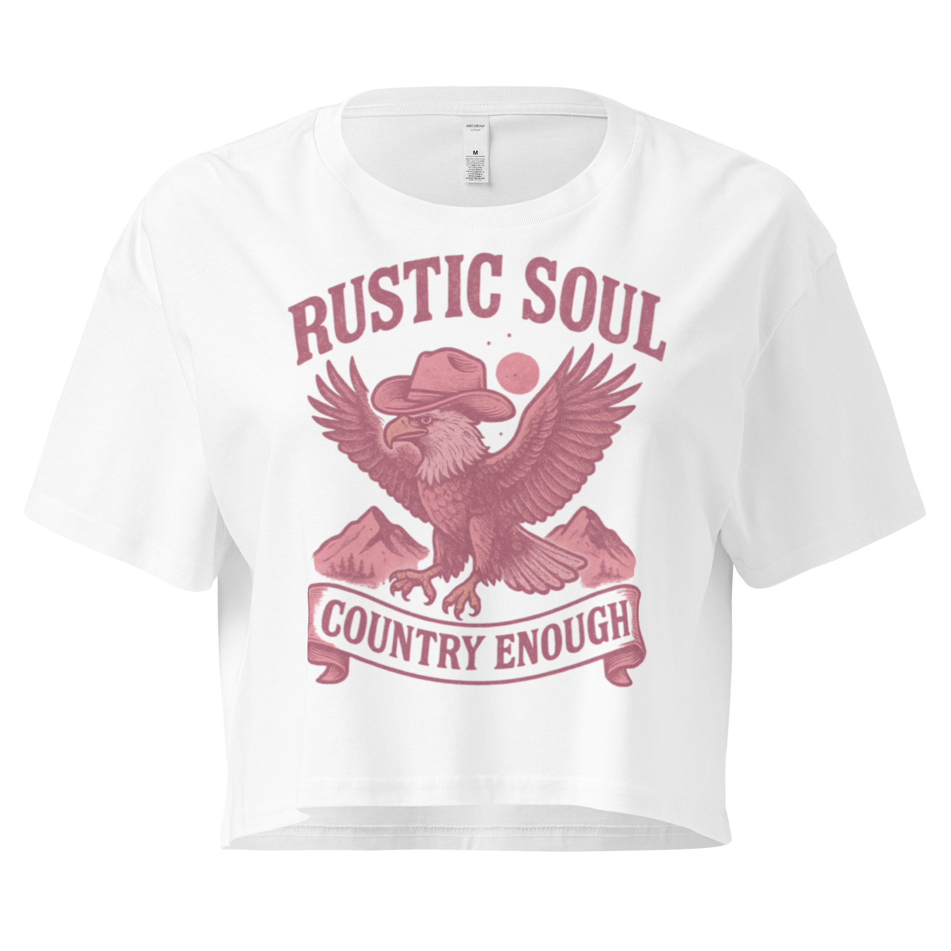 White crop top with graphic of cowboy hat wearing eagle, mountains, and words rustic soul and country enough #white