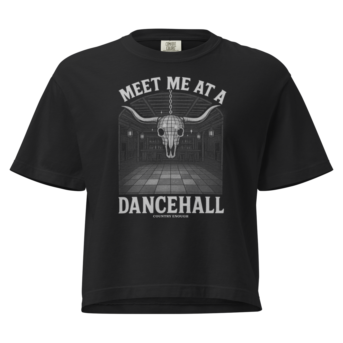 Black t-shirt with graphic of a bar scene, bull skull shaped disco ball, and the words meet me at a dancehall #black