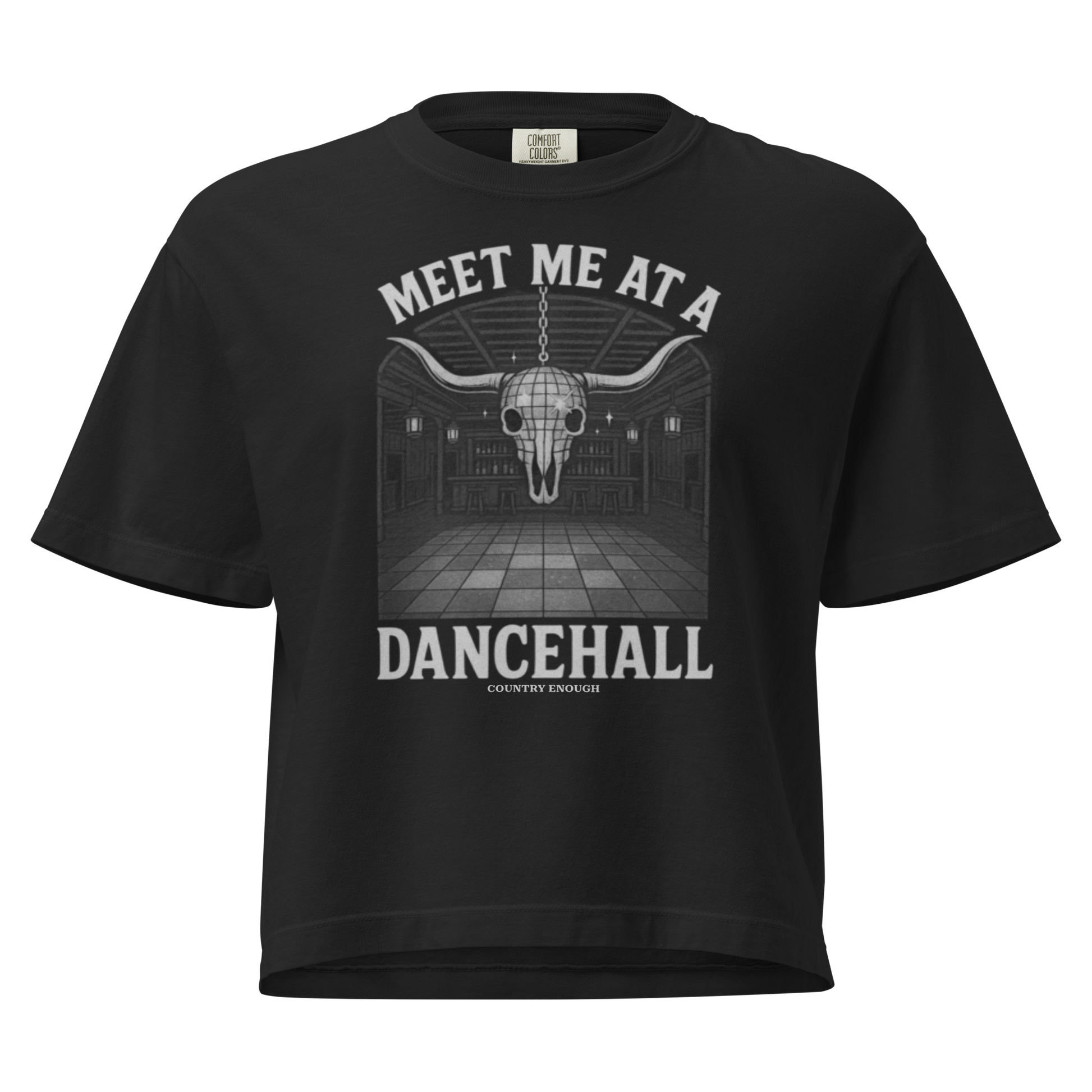 Black t-shirt with graphic of a bar scene, bull skull shaped disco ball, and the words meet me at a dancehall #black