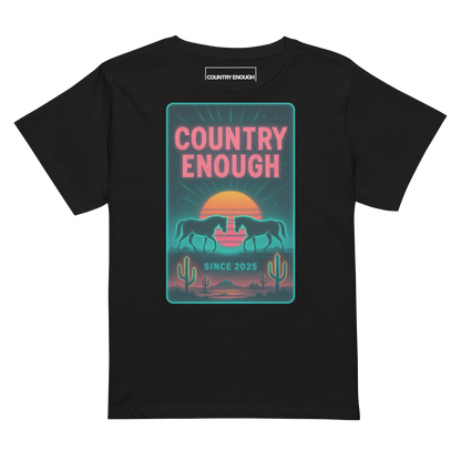 Black t-shirt with graphic of horses, cacti, desert landscape, and sunshine with words country enough #black