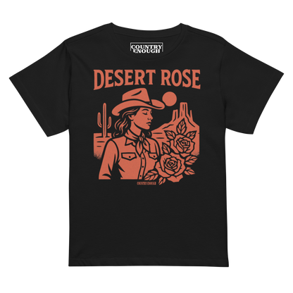 Black t-shirt with graphic of cowgirl, desert landscape, roses, and words desert rose #black