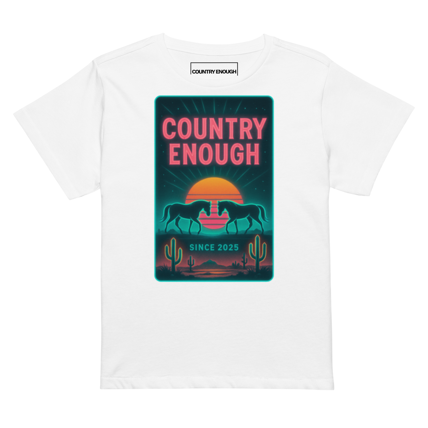 White t-shirt with graphic of horses, cacti, desert landscape, and sunshine with words country enough #white