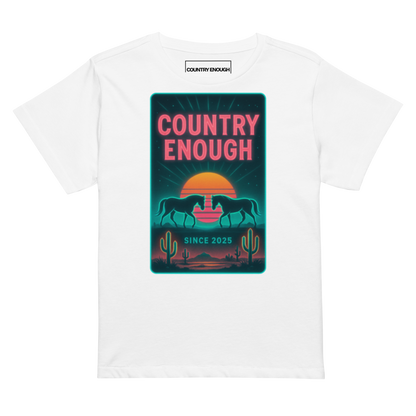 White t-shirt with graphic of horses, cacti, desert landscape, and sunshine with words country enough #white
