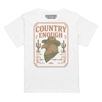 White t-shirt with graphic of cowboy hat and bandana wearing eagle, cacti, and western border with words country enough #white