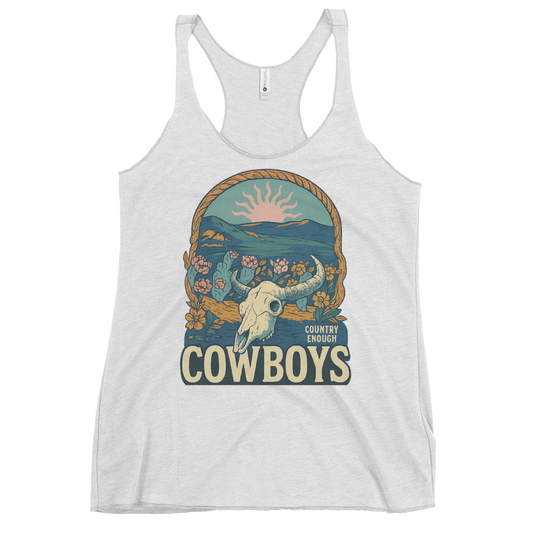 White tank top with graphic of bison skull, sun, mountains, flowers and cacti with a rope border and the word cowboys below #white