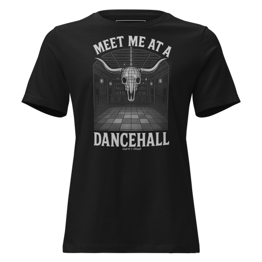 Black t-shirt with graphic of a bar scene, bull skull shaped disco ball, and words meet me at a dancehall, all in gray #black