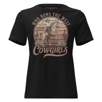 Black t-shirt with graphic of a roping cowgirl on a horse, cacti, and words who runs the west cowgirls #black