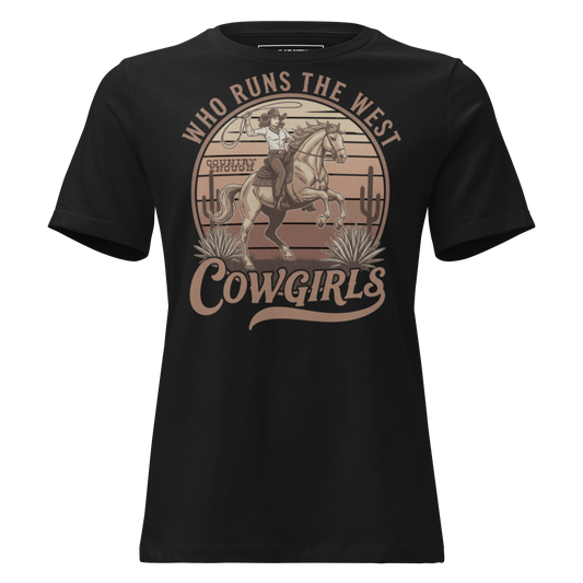 Black t-shirt with graphic of a roping cowgirl on a horse, cacti, and words who runs the west cowgirls #black
