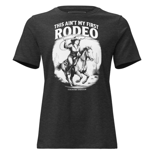 Dark Grey Heather t-shirt with graphic of cowgirl and horse lassoing in a desert scene with the words this ain't my first rodeo and country enough #darkgreyheather
