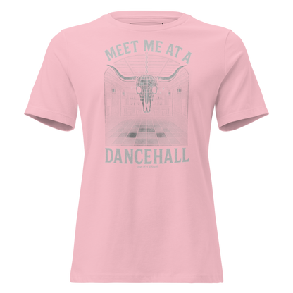 Pink t-shirt with graphic of a bar scene, bull skull shaped disco ball, and words meet me at a dancehall, all in gray #pink