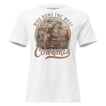 White t-shirt with graphic of a roping cowgirl on a horse, cacti, and words who runs the west cowgirls #white