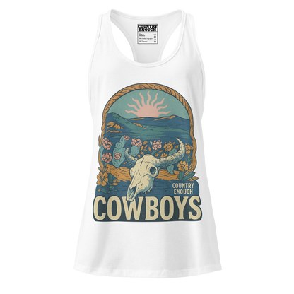 Women's tank top with graphic of bison skull, sun, mountains, flowers and cacti with a rope border and the word cowboys below #white