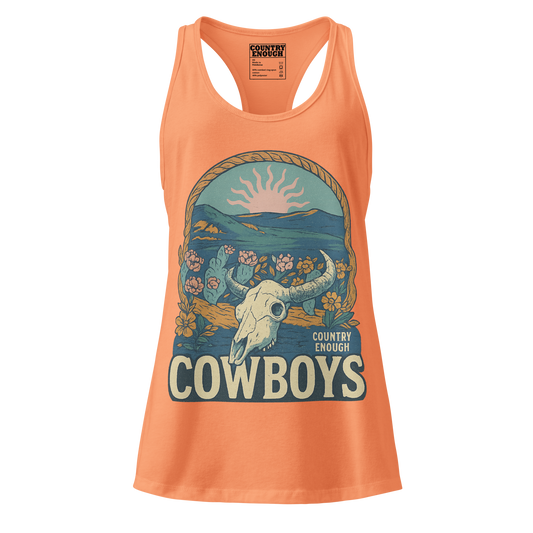 Women's tank top with graphic of bison skull, sun, mountains, flowers and cacti with a rope border and the word cowboys below #lightorange