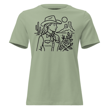 Women's t-shirt with graphic of a cowgirl, desert landscape, sun, cacti, and rose #sage