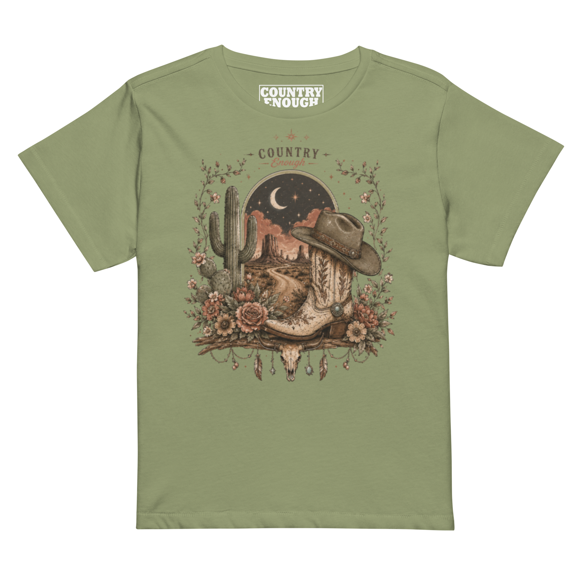 Women's t-shirt with graphic of bull skull, cowboy boot, cowboy hat, desert landscape and night sky. #artichoke