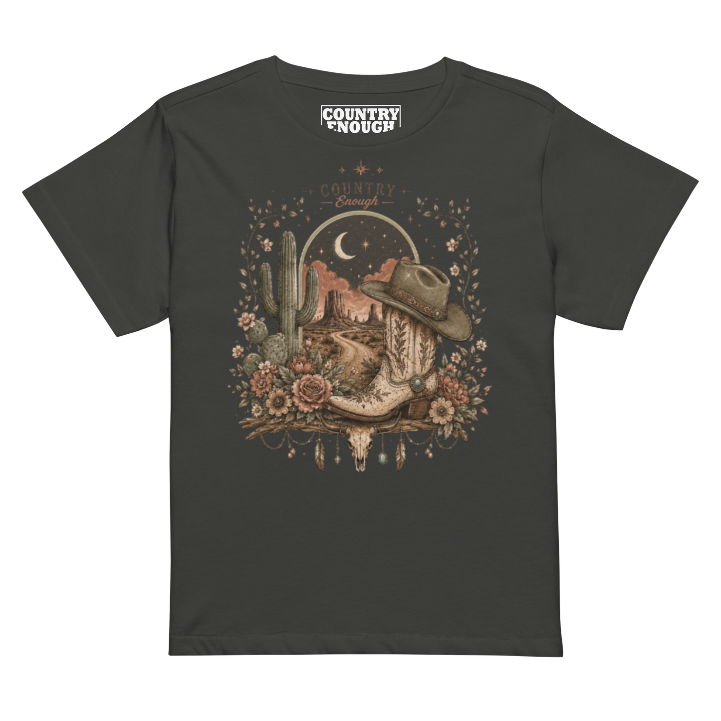 Women's t-shirt with graphic of bull skull, cowboy boot, cowboy hat, desert landscape and night sky. #vintageblack