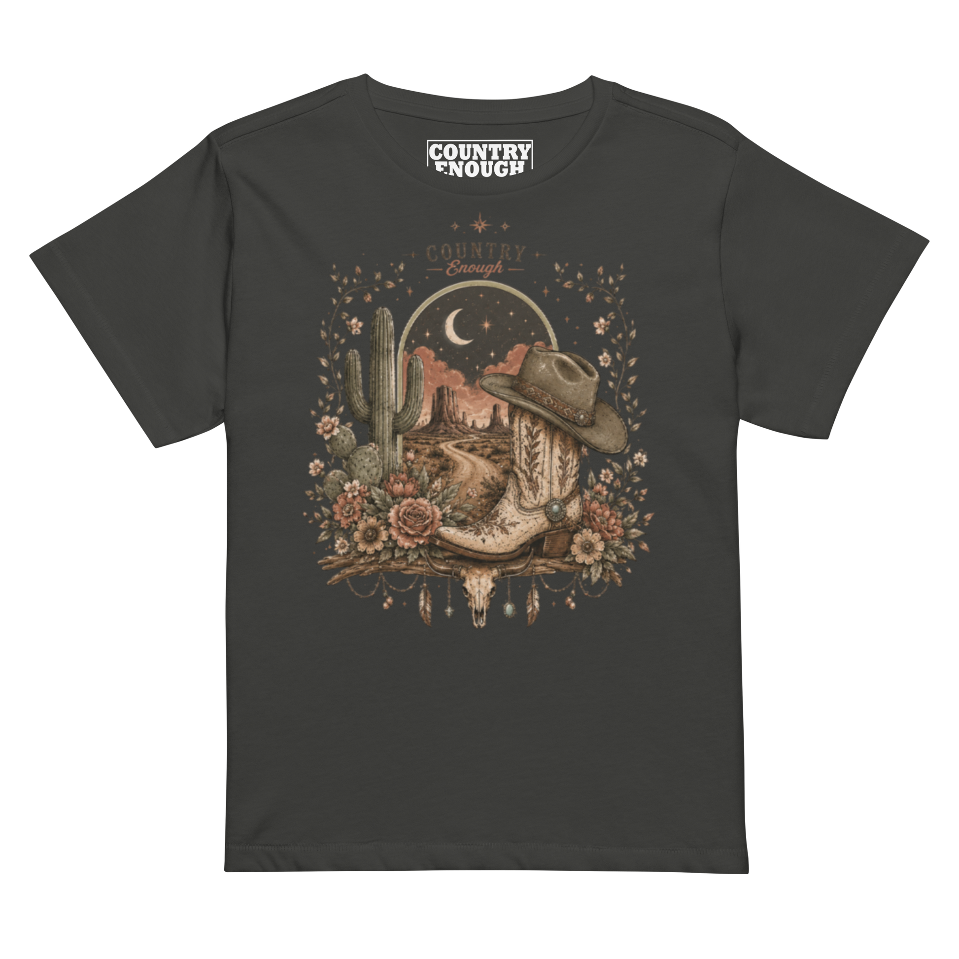 Women's t-shirt with graphic of bull skull, cowboy boot, cowboy hat, desert landscape and night sky. #vintageblack