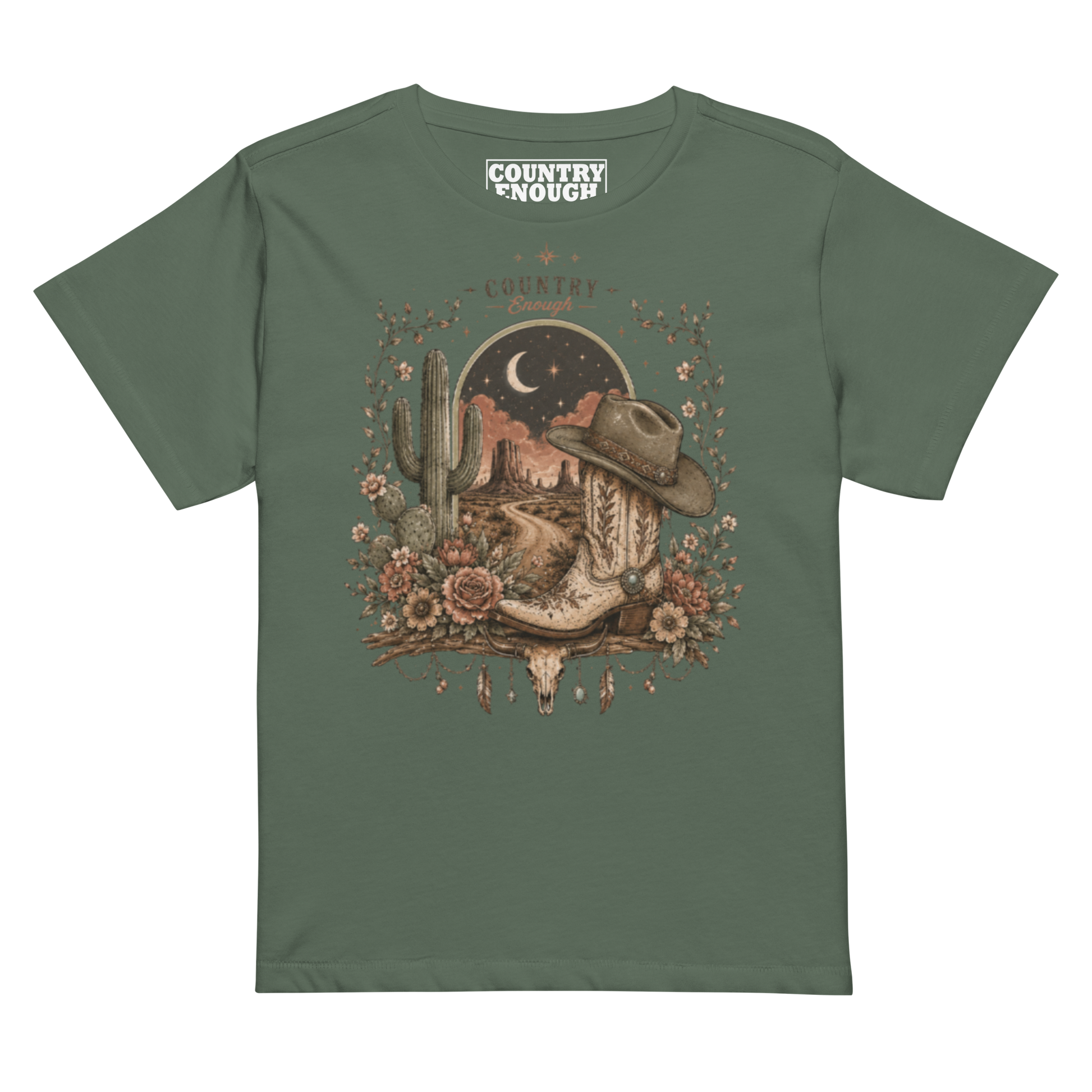 Women's t-shirt with graphic of bull skull, cowboy boot, cowboy hat, desert landscape and night sky. #pine