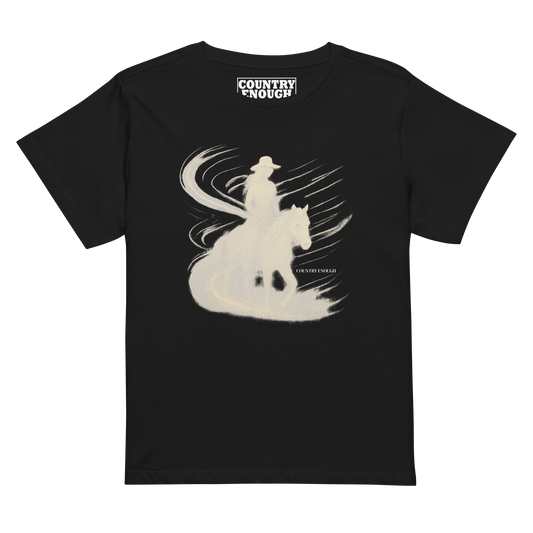 Black t-shirt with graphic of cowgirl riding horse with visual wind present #black